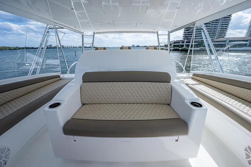 Slide: The Image of 2020 Viking 68 Convertible yacht interior seating area with ocean view. - 22