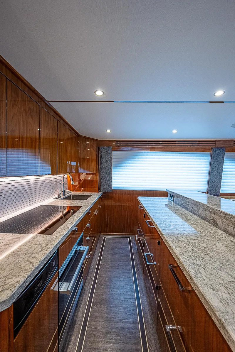 Slide: The Image of Luxurious kitchen interior of 2020 Viking 68 Convertible yacht with modern amenities. - 27