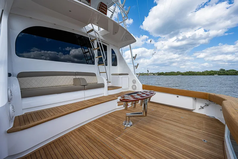 Slide: The Image of 2020 Viking 68 Convertible yacht with spacious deck and scenic water view. - 3