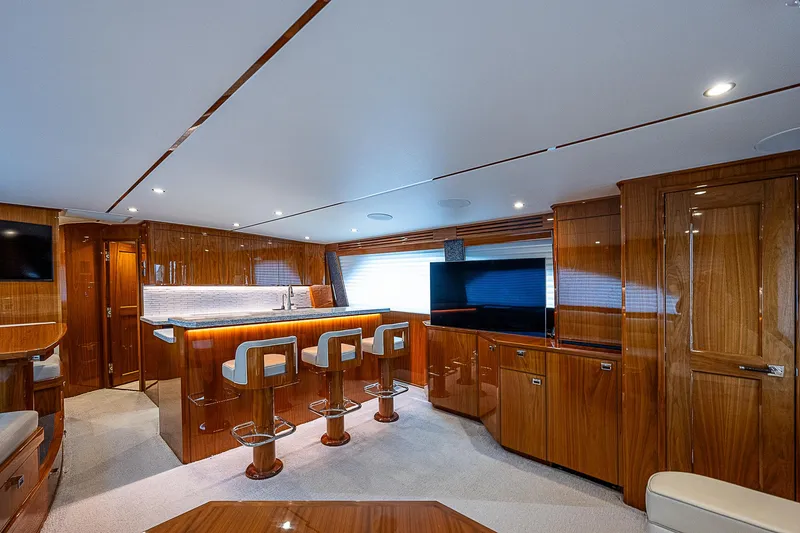Slide: The Image of Luxurious interior of a 2020 Viking 68 Convertible yacht with modern furnishings. - 35