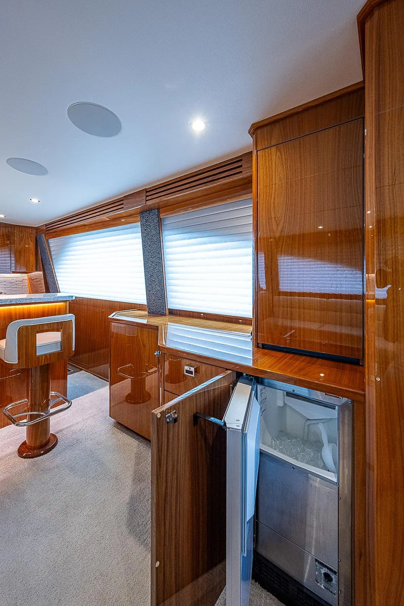 Slide: The Image of Interior of 2020 Viking 68 Convertible yacht with modern wooden cabinetry. - 36