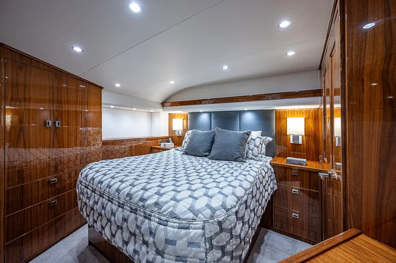 Slide: The Image of Luxurious bedroom interior of 2020 Viking 68 Convertible yacht with modern lighting. - 45