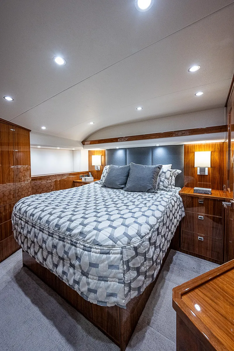 Slide: The Image of Luxurious bedroom interior of 2020 Viking 68 Convertible yacht with modern lighting. - 46