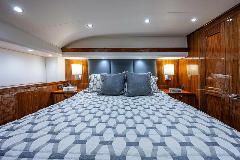 Slide: The Image of Luxurious bedroom interior of 2020 Viking 68 Convertible yacht with modern lighting. - 47