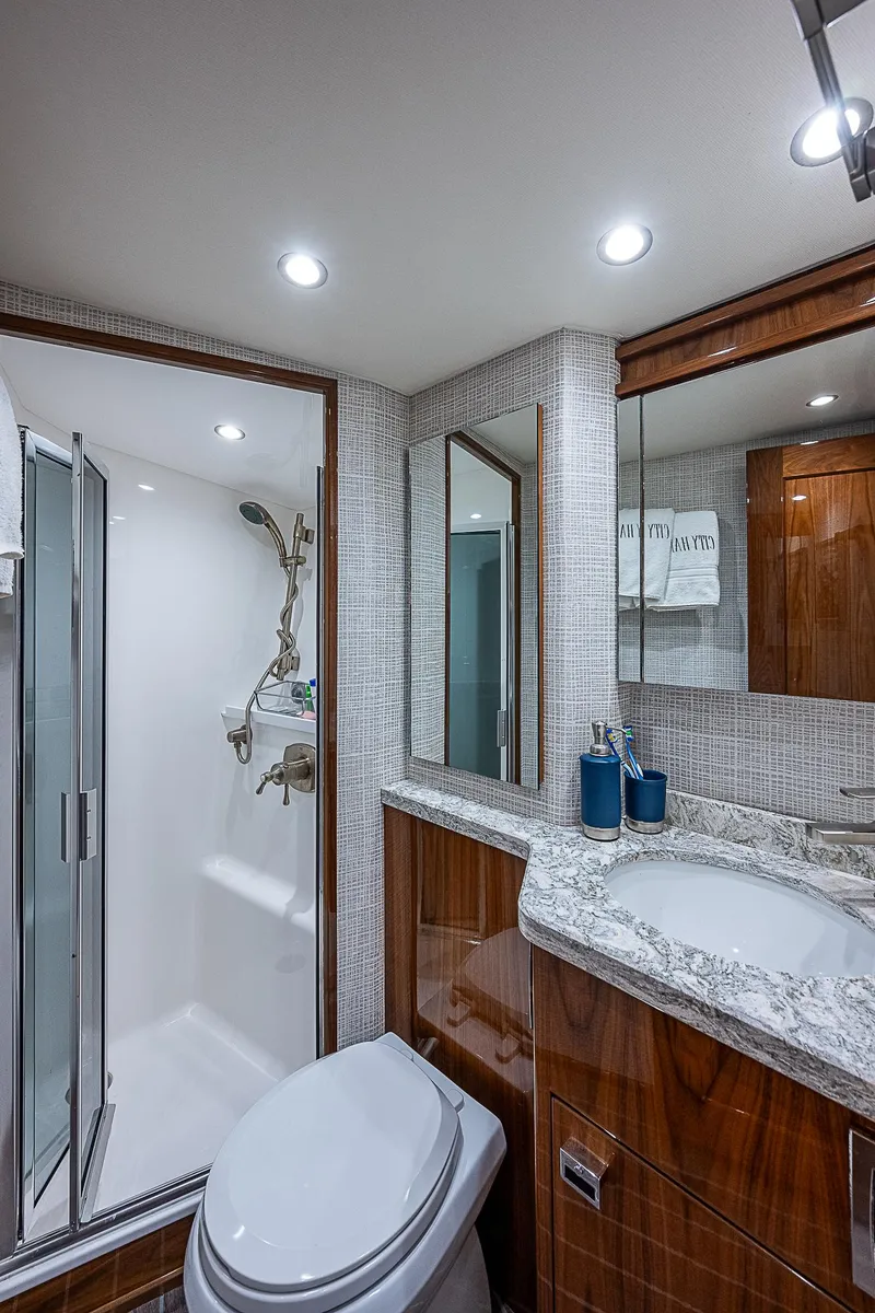 Slide: The Image of Luxurious bathroom in 2020 Viking 68 Convertible yacht with modern fixtures and elegant design. - 48