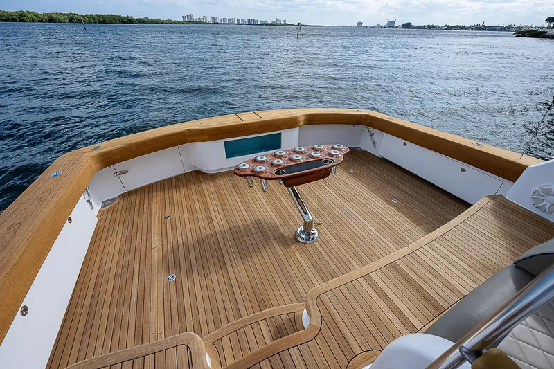 Slide: The Image of 2020 Viking 68 Convertible yacht with spacious teak deck and ocean view. - 6