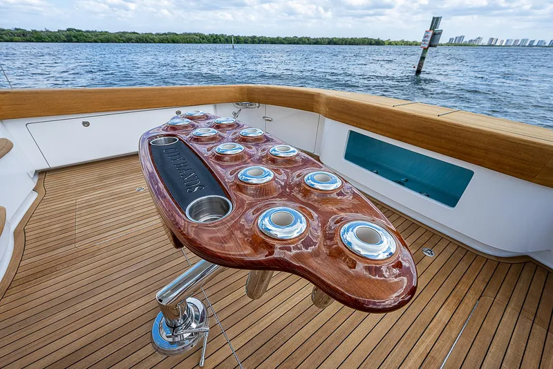 Slide: The Image of 2020 Viking 68 Convertible yacht with teak deck and custom fishing rod holders. - 8