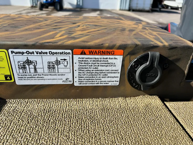 Slide: The Image of 2024 G3 Sportsman 1710 VYL pump-out valve operation and warning labels. - 12