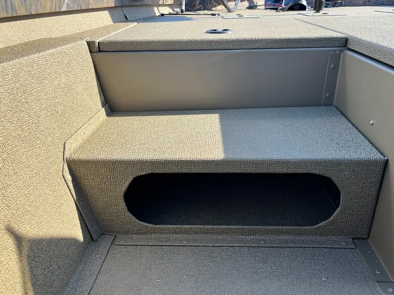 Slide: The Image of 2024 G3 Sportsman 1710 VYL boat interior step with storage compartment. - 14
