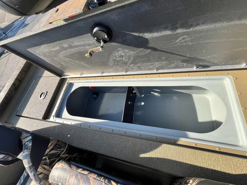 Slide: The Image of Open storage compartment in 2024 G3 Sportsman 1710 VYL boat. - 16