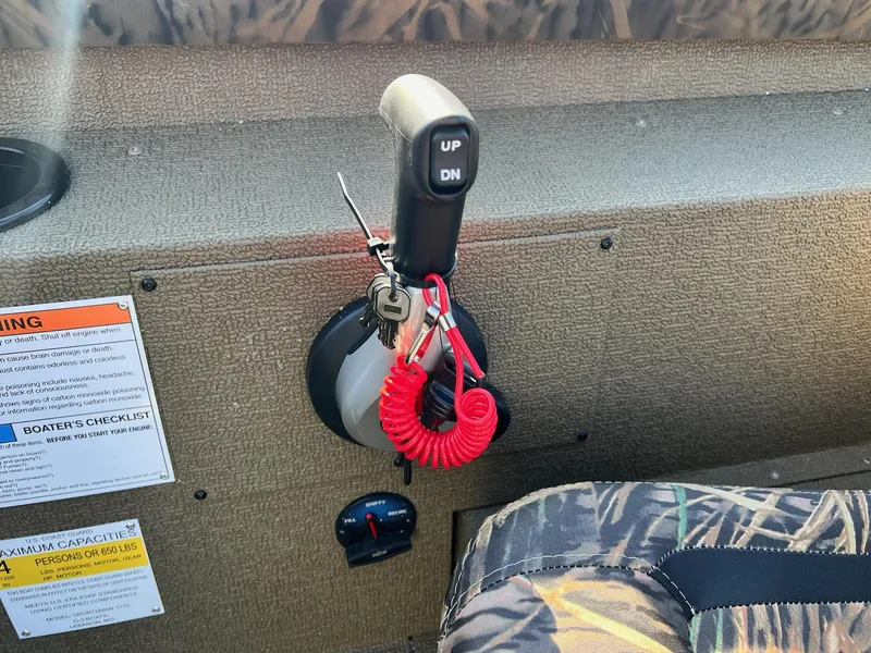 Slide: The Image of Control panel of 2024 G3 Sportsman 1710 VYL boat with safety warnings and checklist. - 17