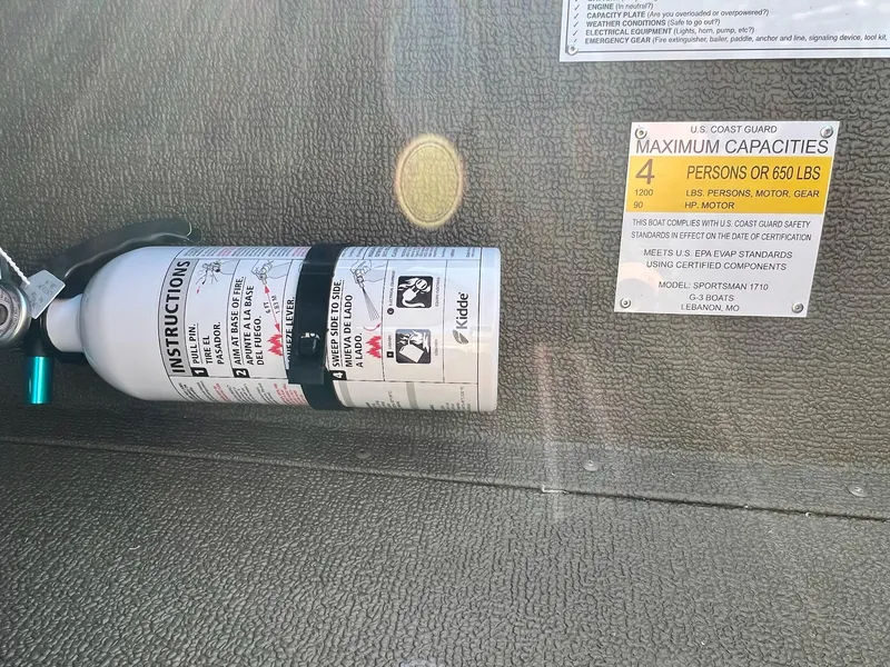 Slide: The Image of Fire extinguisher and capacity label on 2024 G3 Sportsman 1710 VYL boat. - 22