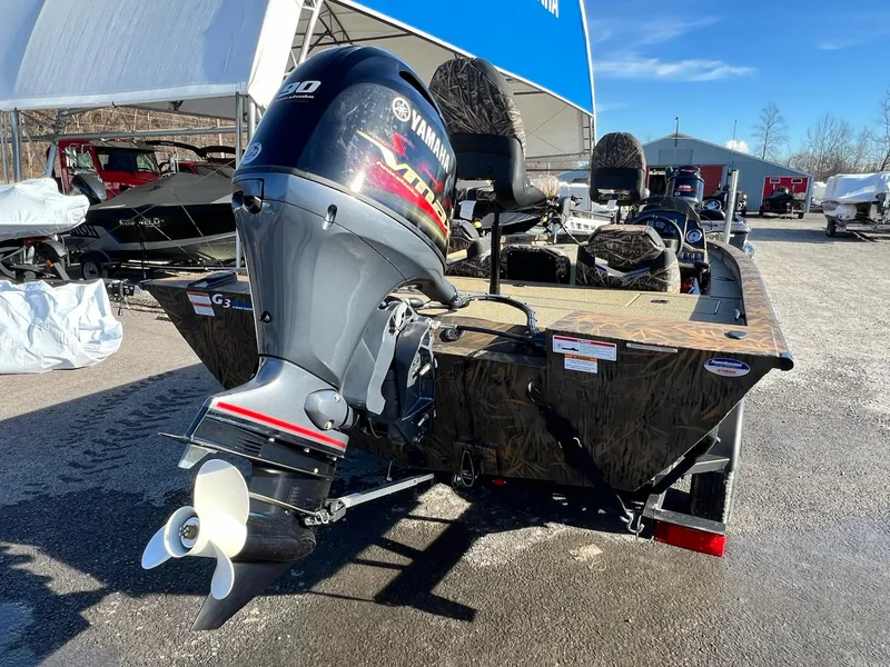 Slide: The Image of 2024 G3 Sportsman 1710 VYL boat with Yamaha outboard motor in a dealership lot. - 28