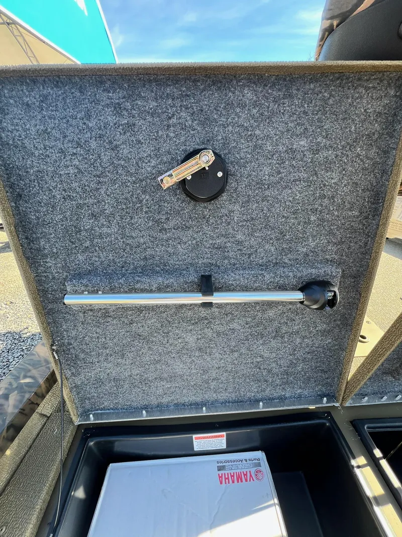 Slide: The Image of 2024 G3 Sportsman 1710 VYL storage compartment with Yamaha parts box. - 31