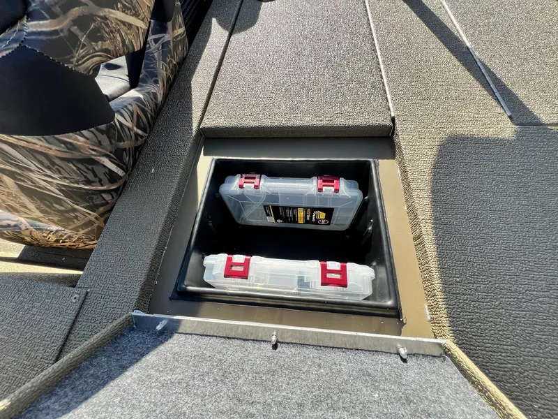 Slide: The Image of Storage compartment with tackle boxes on the 2024 G3 Sportsman 1710 VYL boat. - 34