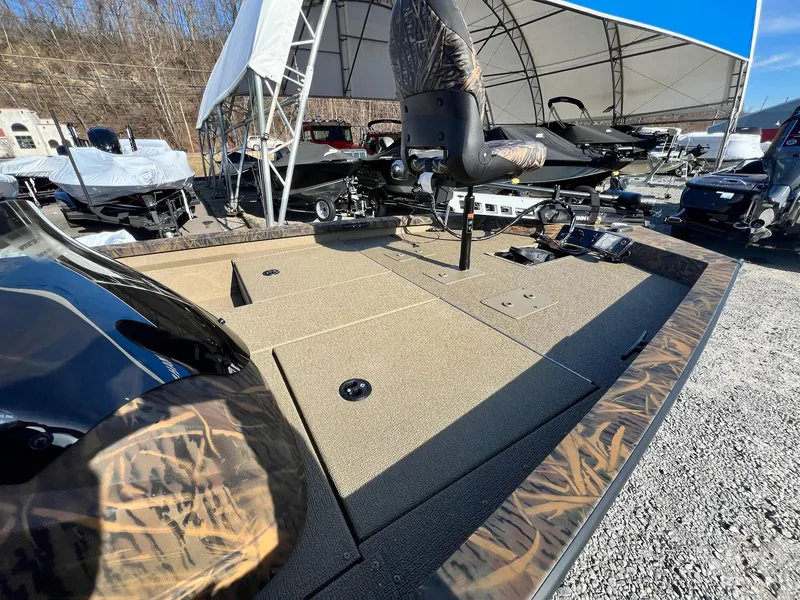 Slide: The Image of 2024 G3 Sportsman 1710 VYL fishing boat on display at a dealership. - 38