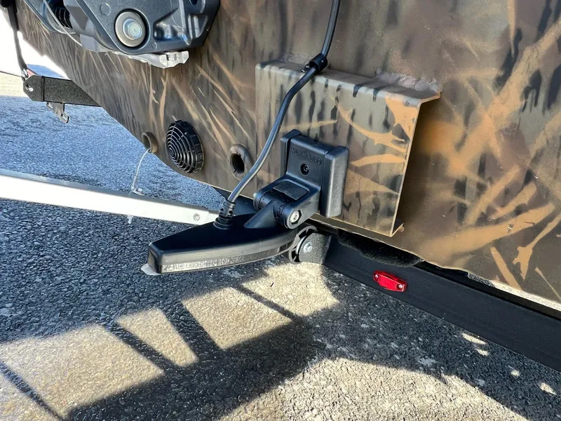 Slide: The Image of Close-up of 2024 G3 Sportsman 1710 VYL boat's transom with camo pattern. - 9