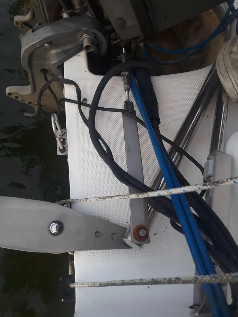 Slide: The Image of Close-up of a 1996 MacGregor 26 "X" sailboat's steering mechanism and cables. - 17