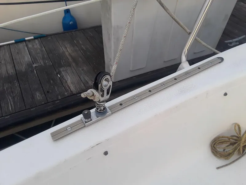 Slide: The Image of Close-up of a 1996 MacGregor 26 "X" sailboat deck with rigging details. - 21