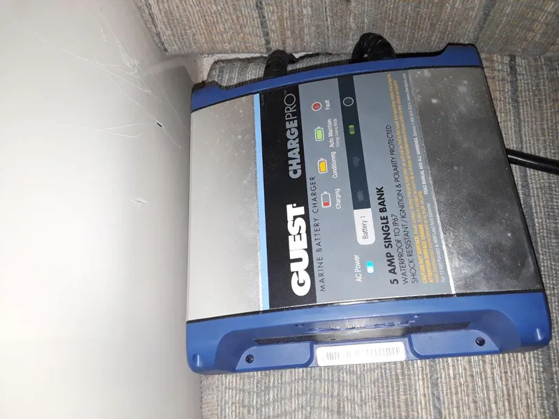 Slide: The Image of Battery charger labeled "Guest Charge Pro" on a MacGregor 26 "X" boat, 1996 model. - 43