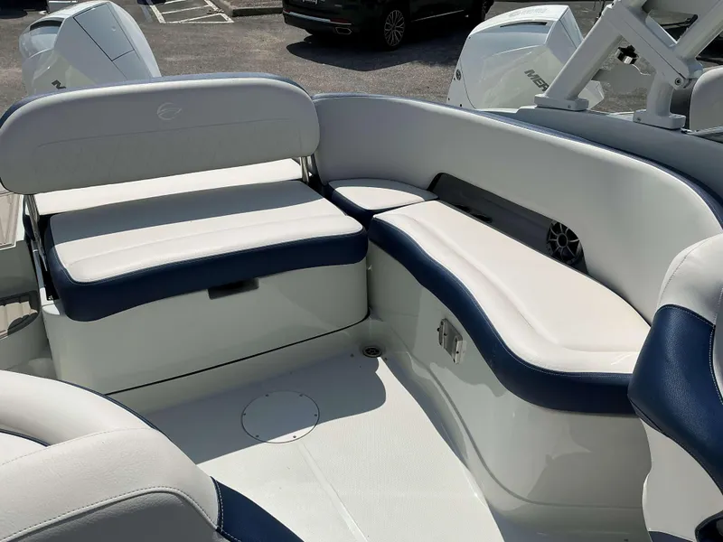 Slide: The Image of 2024 Crownline 260XSS boat interior with white and blue seating. - 14