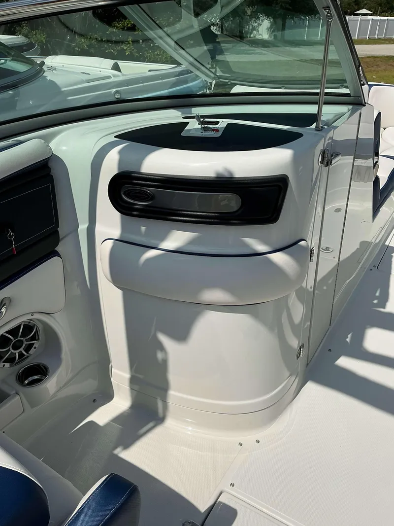 Slide: The Image of 2024 Crownline 260XSS boat interior with sleek white design and modern features. - 4
