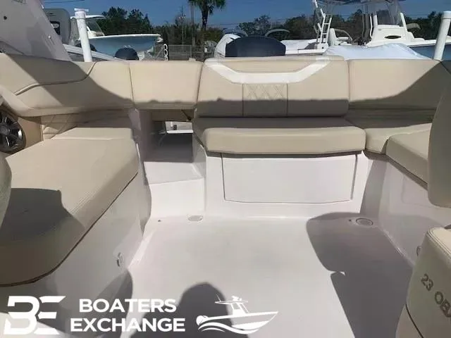 Slide: The Image of Interior view of a 2018 Regal OBX boat with beige seating, Boaters Exchange logo. - 3