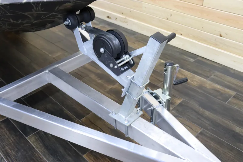 Slide: The Image of 2024 Excel 1651 Viper boat trailer winch system on wooden floor. - 15