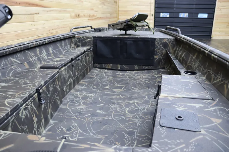 Slide: The Image of 2024 Excel 1651 Viper boat interior with camouflage design and seating. - 17