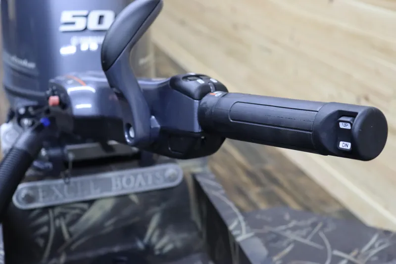 Slide: The Image of Close-up of 2024 Excel 1651 Viper boat throttle handle and engine. - 20