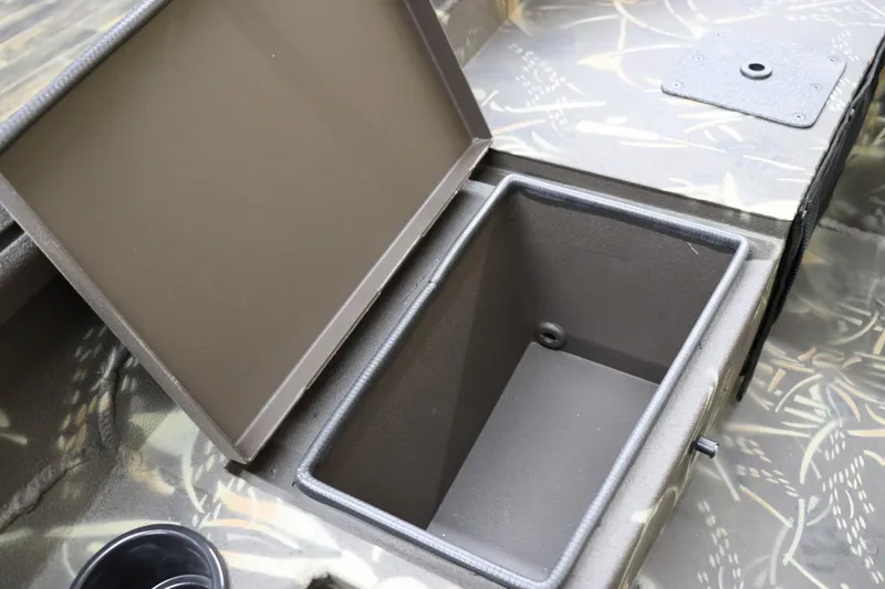 Slide: The Image of 2024 Excel 1651 Viper boat storage compartment with open lid. - 21