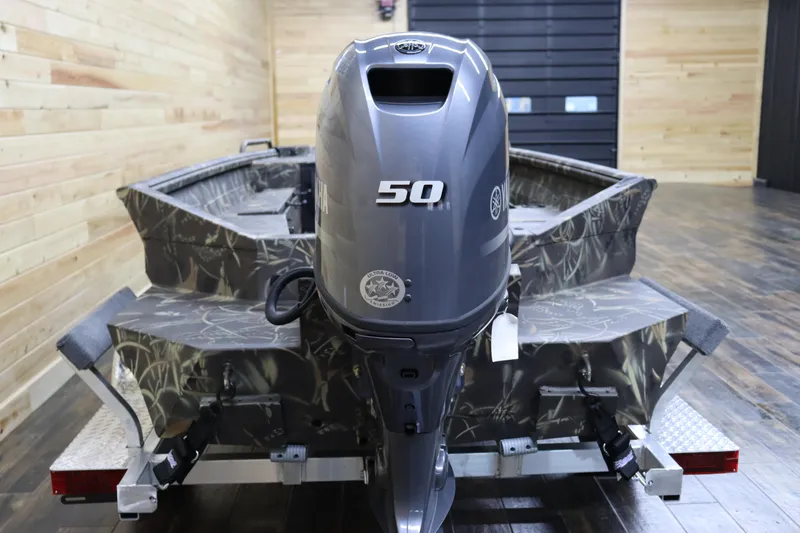 Slide: The Image of 2024 Excel 1651 Viper boat with 50 HP outboard motor in showroom. - 4