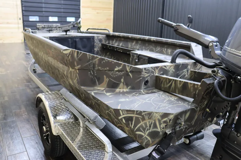Slide: The Image of 2024 Excel 1651 Viper boat with camouflage design on trailer. - 5