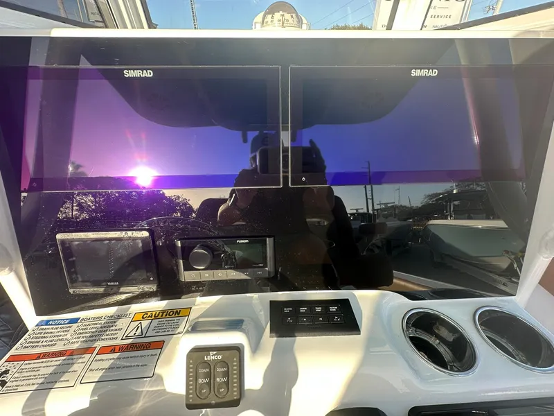 Slide: The Image of Dashboard of 2024 NauticStar 292 Legacy boat with dual Simrad displays. - 18