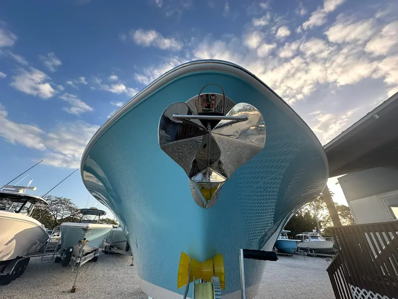 Slide: The Image of 2024 NauticStar 292 Legacy boat under a blue sky. - 2