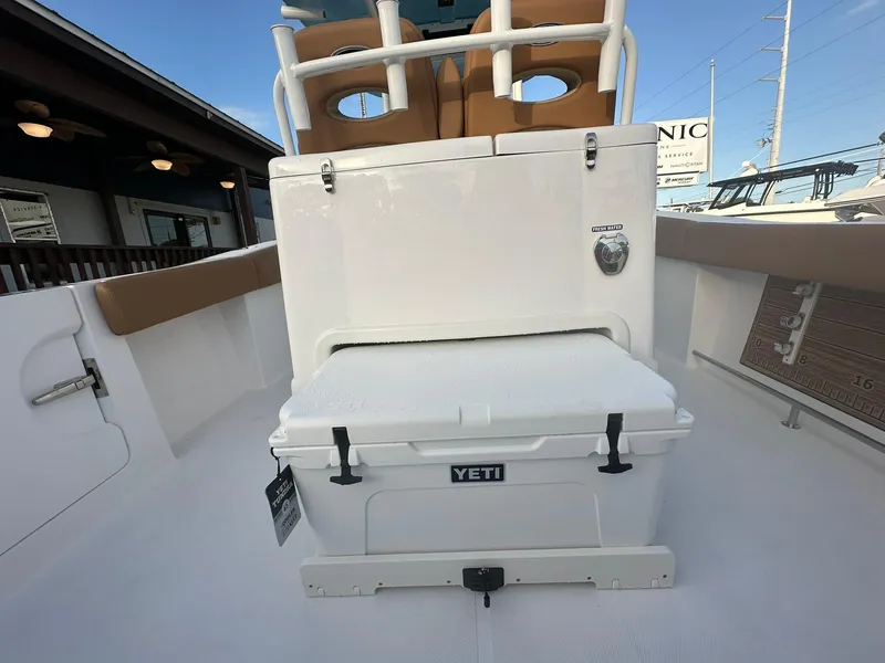 Slide: The Image of 2024 NauticStar 292 Legacy boat with YETI cooler on deck. - 27