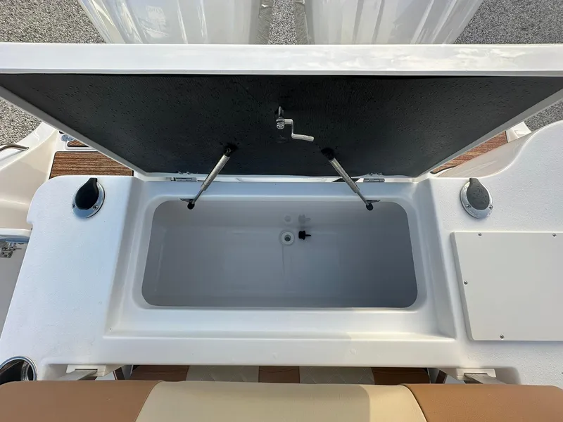 Slide: The Image of Open storage compartment on 2024 NauticStar 292 Legacy boat. - 35