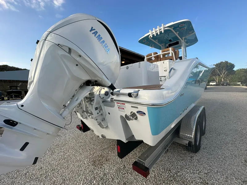 Slide: The Image of 2024 NauticStar 292 Legacy boat with Yamaha outboard engine on trailer. - 39