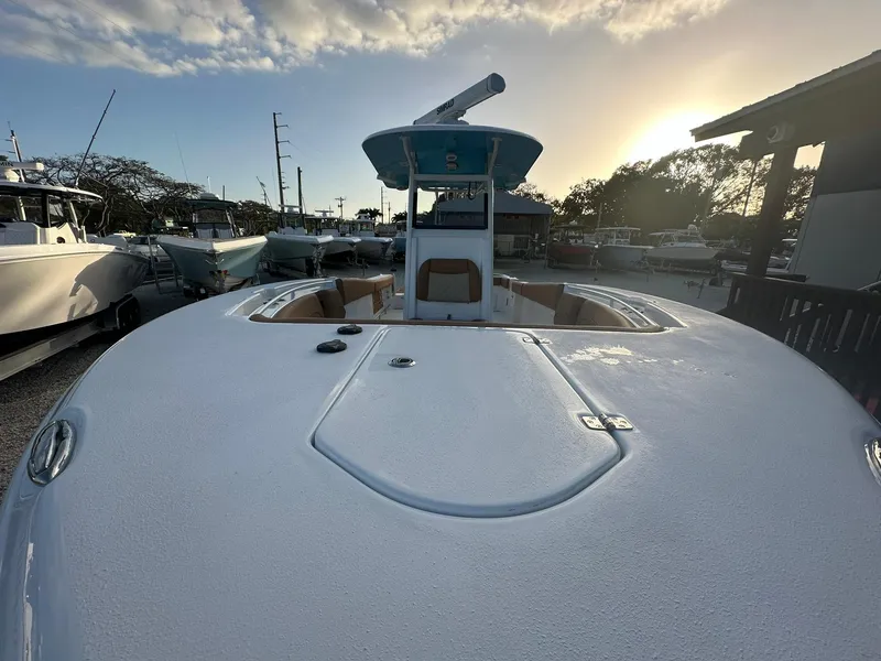 Slide: The Image of 2024 NauticStar 292 Legacy boat docked at sunset. - 4