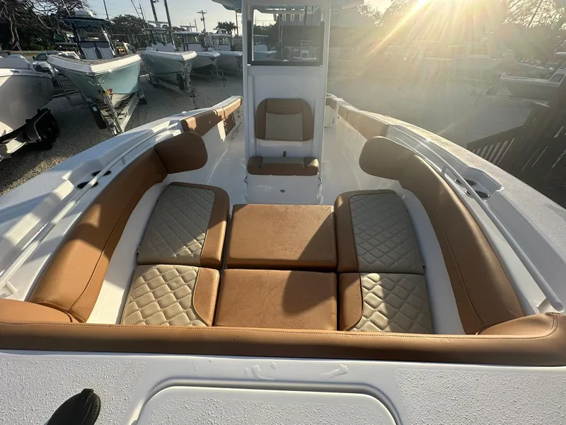 Slide: The Image of 2024 NauticStar 292 Legacy boat with luxurious seating and sunlit deck. - 44