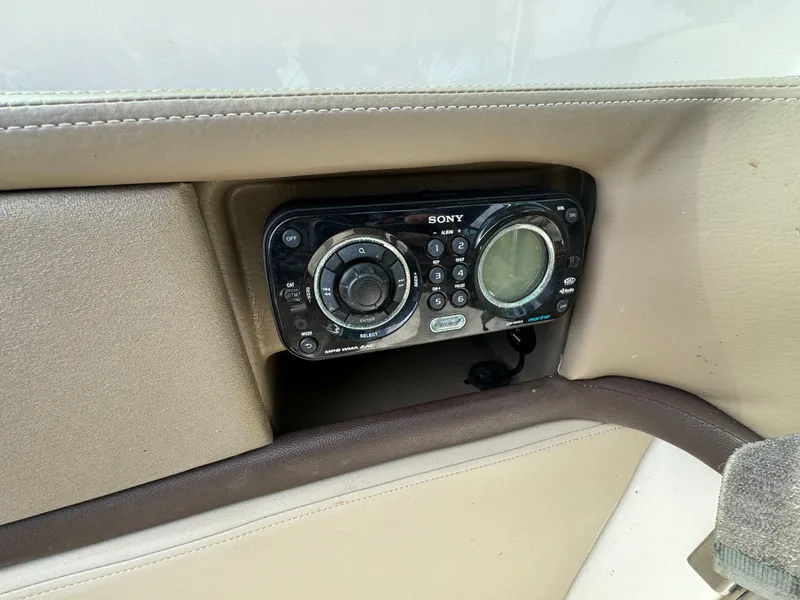 Slide: The Image of Sony stereo system on 2013 Sea Ray 250 SLX boat dashboard. - 13