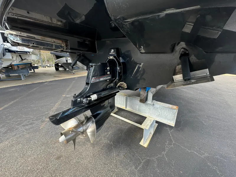 Slide: The Image of 2013 Sea Ray 250 SLX boat propeller and stern drive on a trailer. - 5