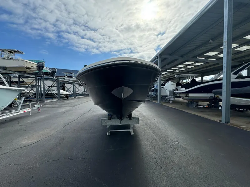 Slide: The Image of 2013 Sea Ray 250 SLX boat in storage facility. - 8