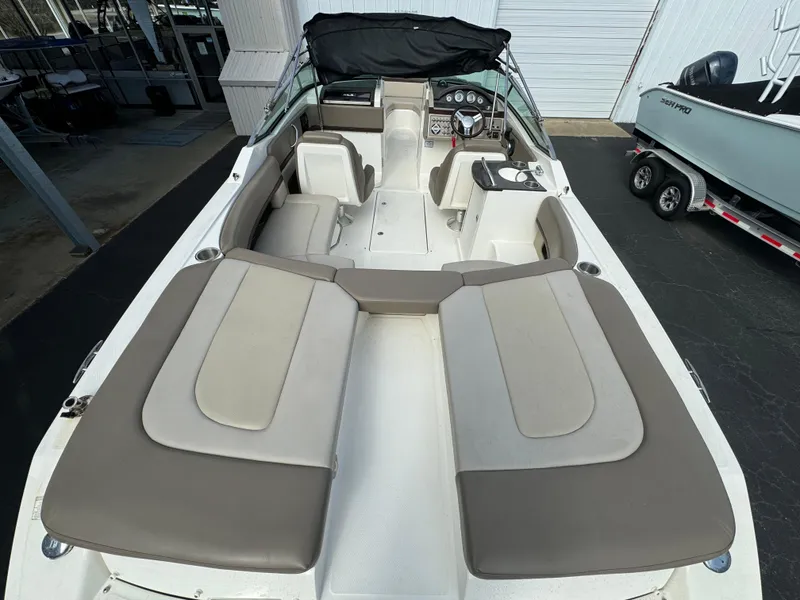 Slide: The Image of 2013 Sea Ray 250 SLX boat with spacious seating and modern interior. - 9