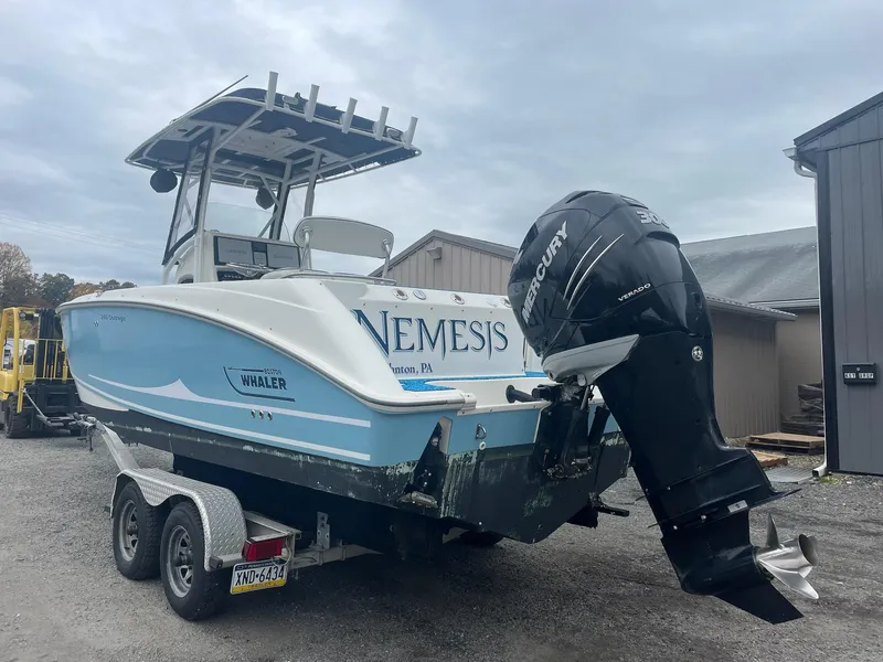 Slide: The Image of 2005 Boston Whaler Outrage 240 boat on trailer, rear view. - 2