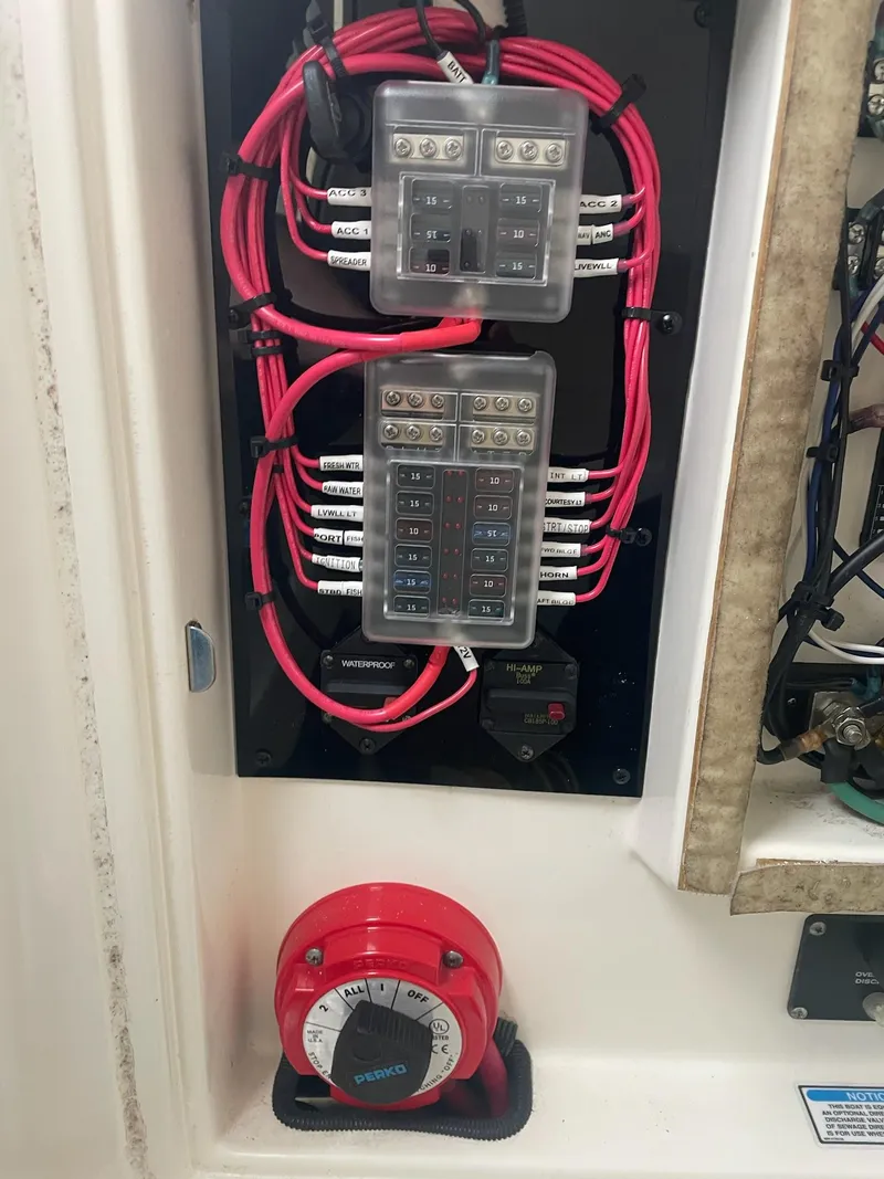 Slide: The Image of Electrical panel of a 2005 Boston Whaler Outrage 240 boat. - 21