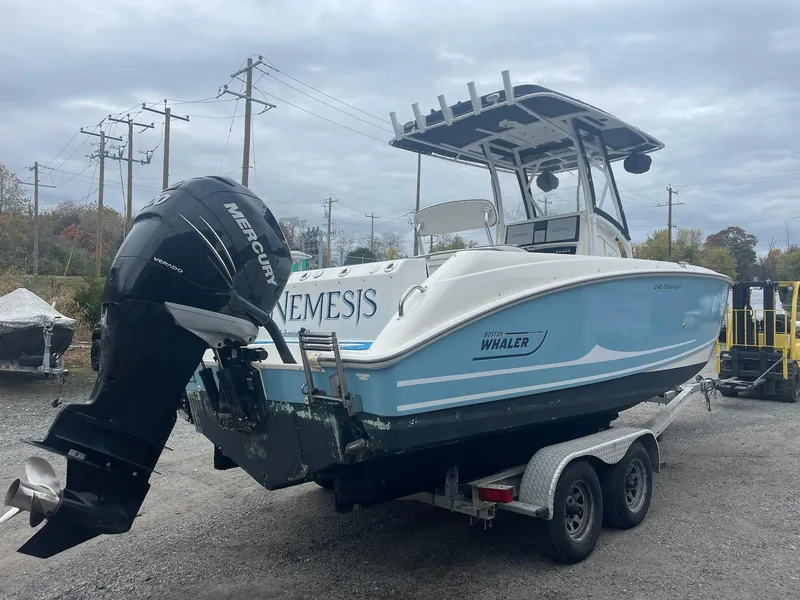 Slide: The Image of 2005 Boston Whaler Outrage 240 on trailer, outboard motor. - 3