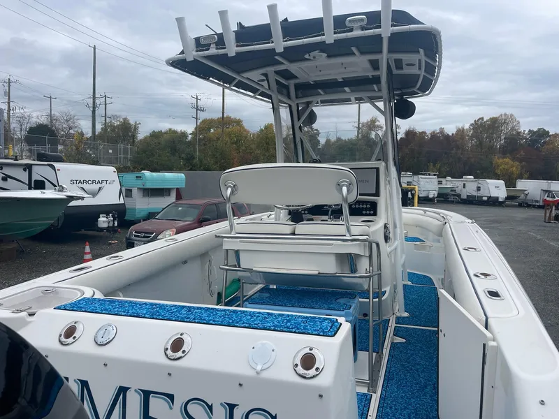 Slide: The Image of 2005 Boston Whaler Outrage 240 boat in a parking lot. - 4