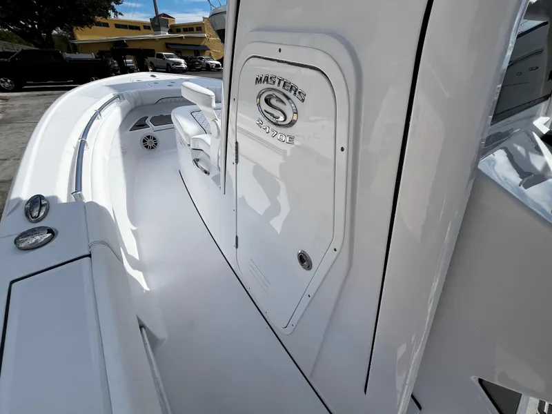 Slide: The Image of 2024 Sportsman Masters 247OE Bay Boat interior view, showcasing sleek white design. - 19