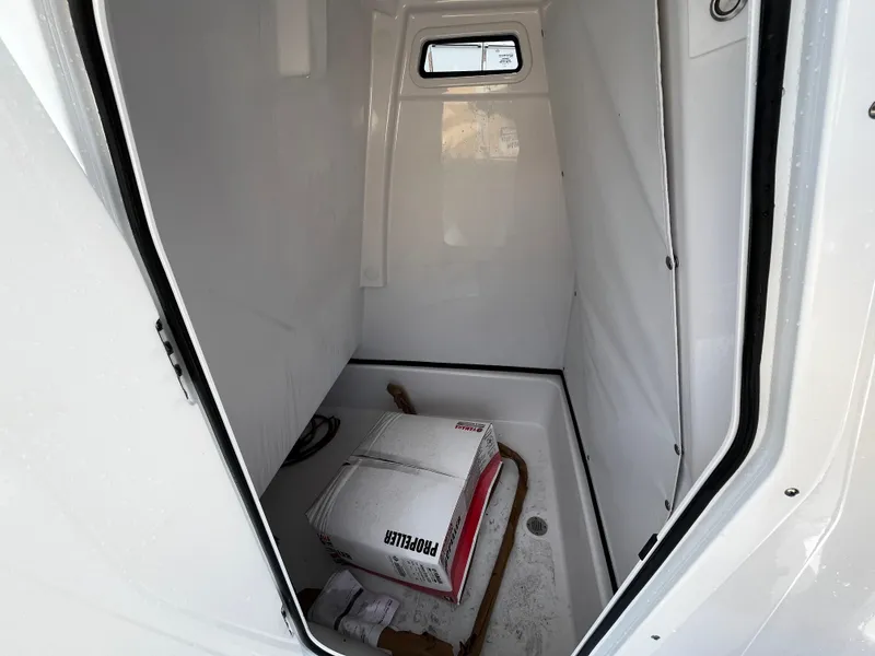 Slide: The Image of 2024 Sportsman Masters 247OE Bay Boat interior storage compartment. - 20